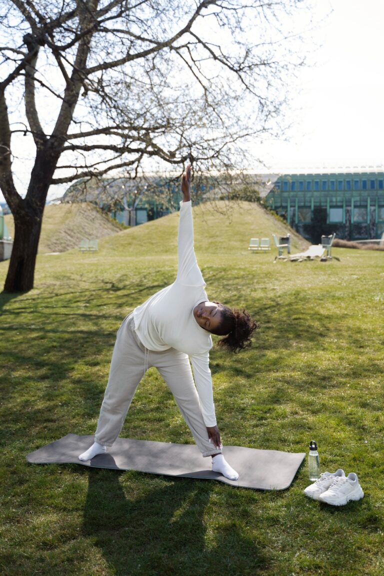 Full shot woman stretching in nature