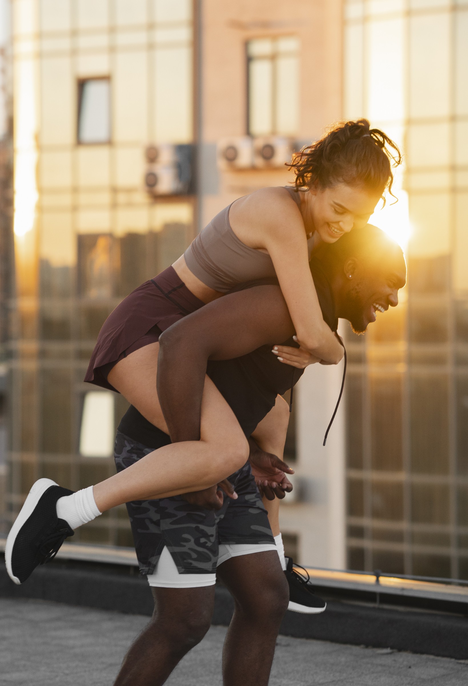 Morning vs. Evening Workouts: How Science Optimizes Exercise Timing for Better Health people-working-out-together-sunset-outdoors