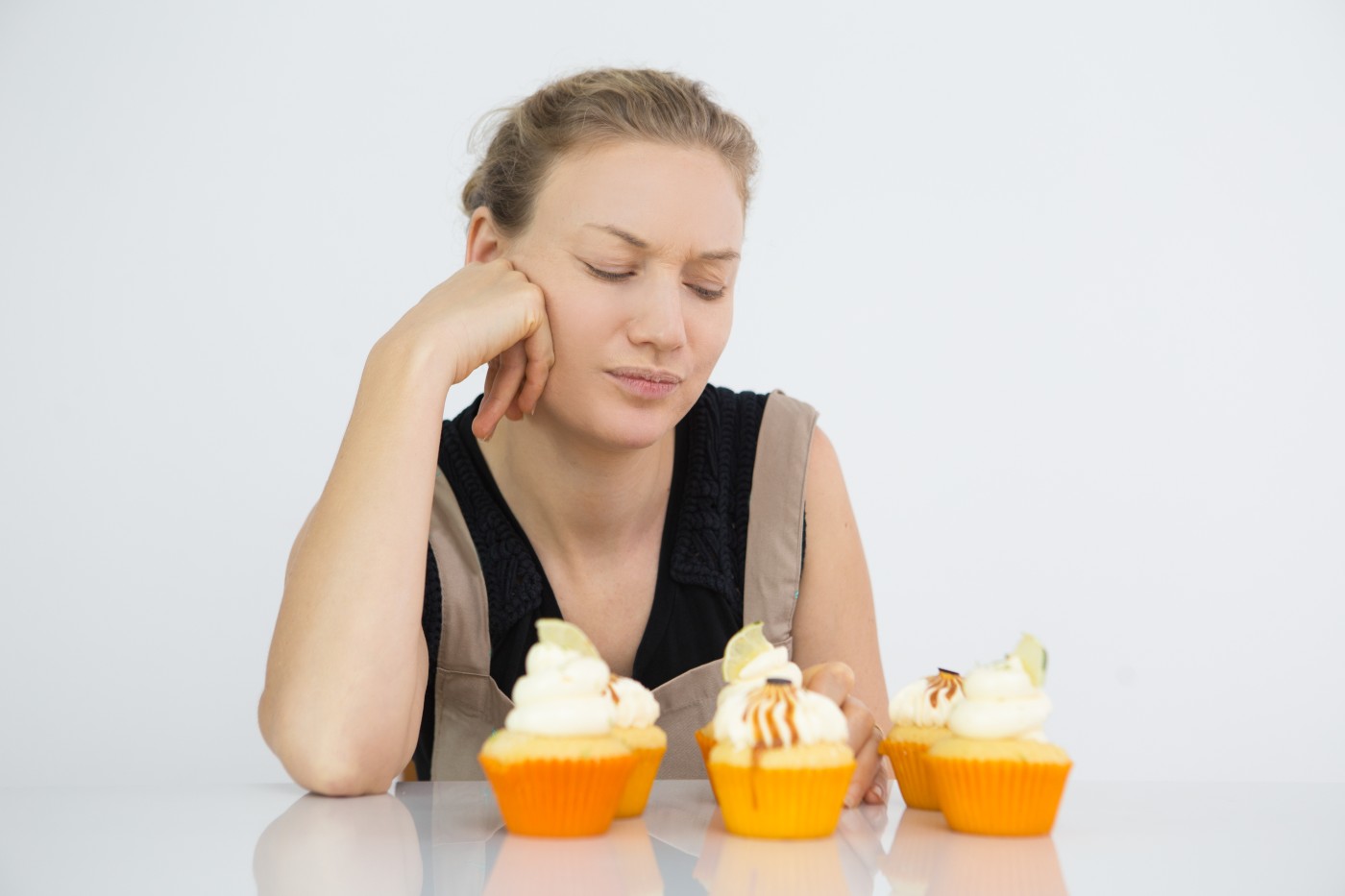 Sugar Crash: How High-Sugar Diets Damage Your Body and Brain female confectioner thinking missing ingredient